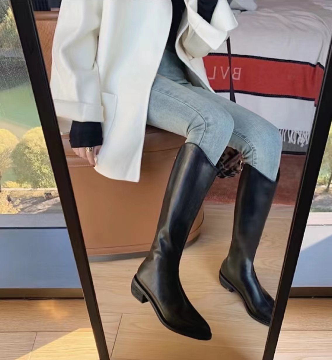 Simple high-top boots that go below the knee