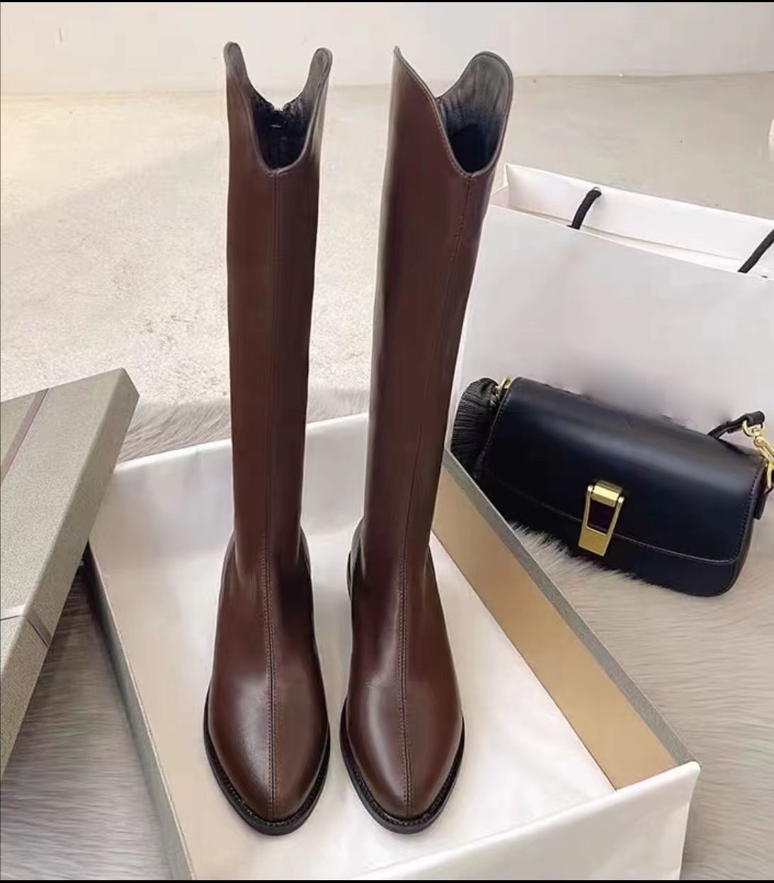 Simple high-top boots that go below the knee