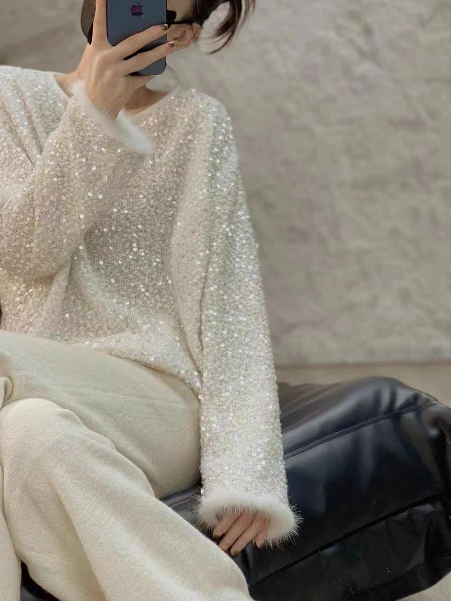 Women's furry top with sequin cuffs