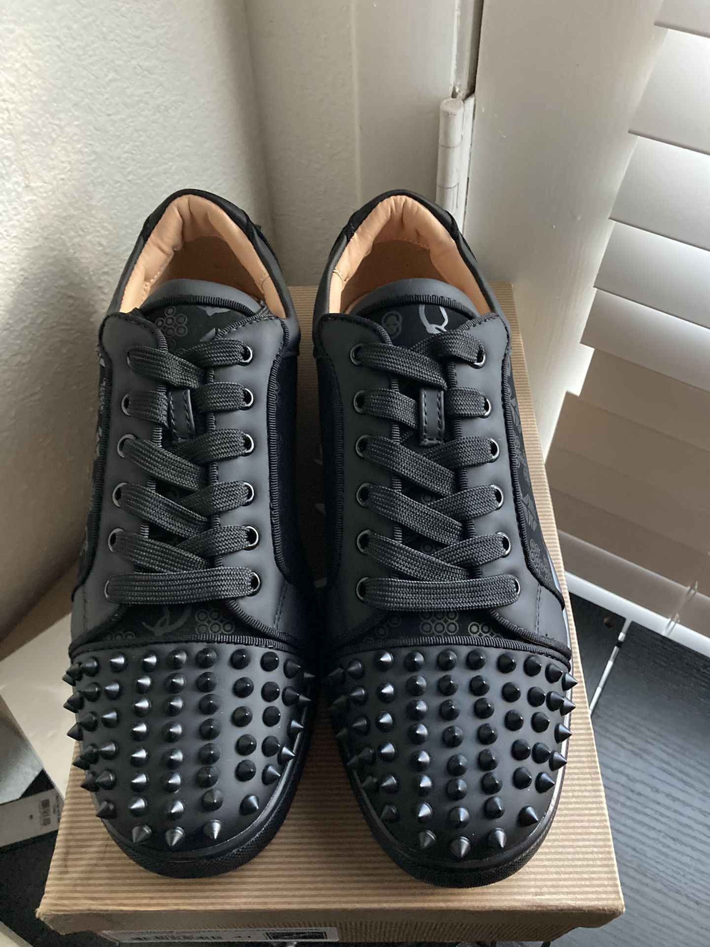 Studded Casual Shoes With A Signature Red Sole