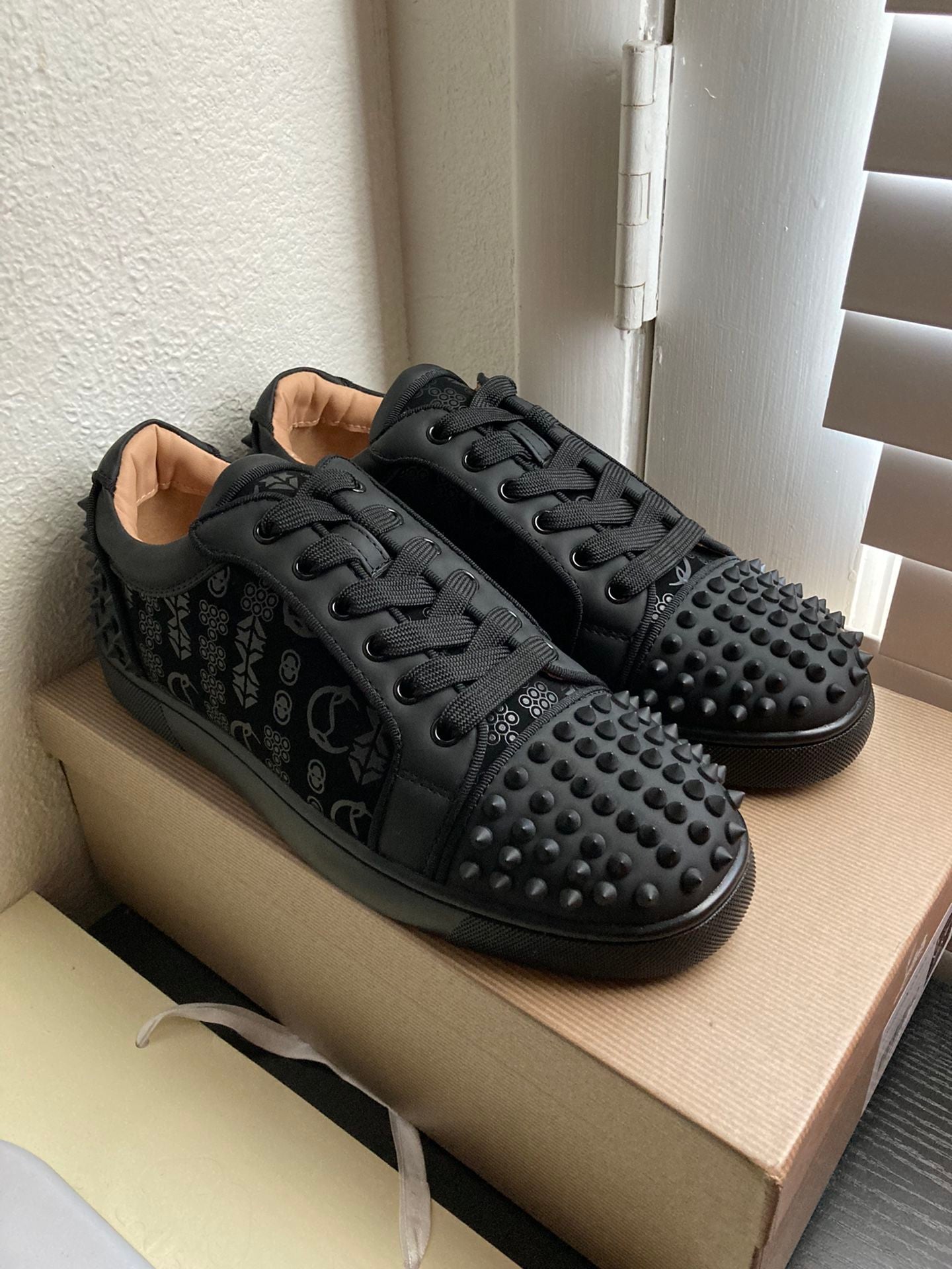 Studded Casual Shoes With A Signature Red Sole